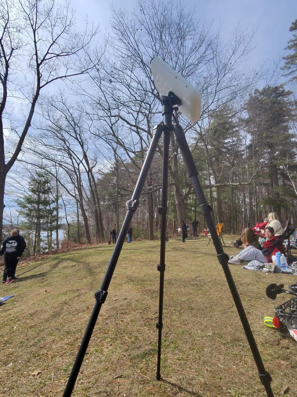 People watching the total solar eclipse on the shore of Lake Champlain Vermont