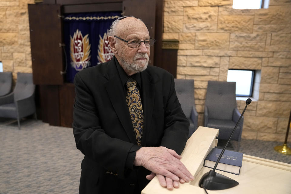 In this Dec. 22, 2022, photo, Lawrence Schwartz poses for a photo inside of Congregation Beth Israel, in Colleyville, Texas. A year ago, a rabbi and three others survived a hostage standoff at their synagogue in Colleyville, Texas. Their trauma did not disappear, though, with the FBI's killing of the pistol-wielding captor. Healing from the Jan. 15, 2022, ordeal is ongoing. (AP Photo/Tony Gutierrez)