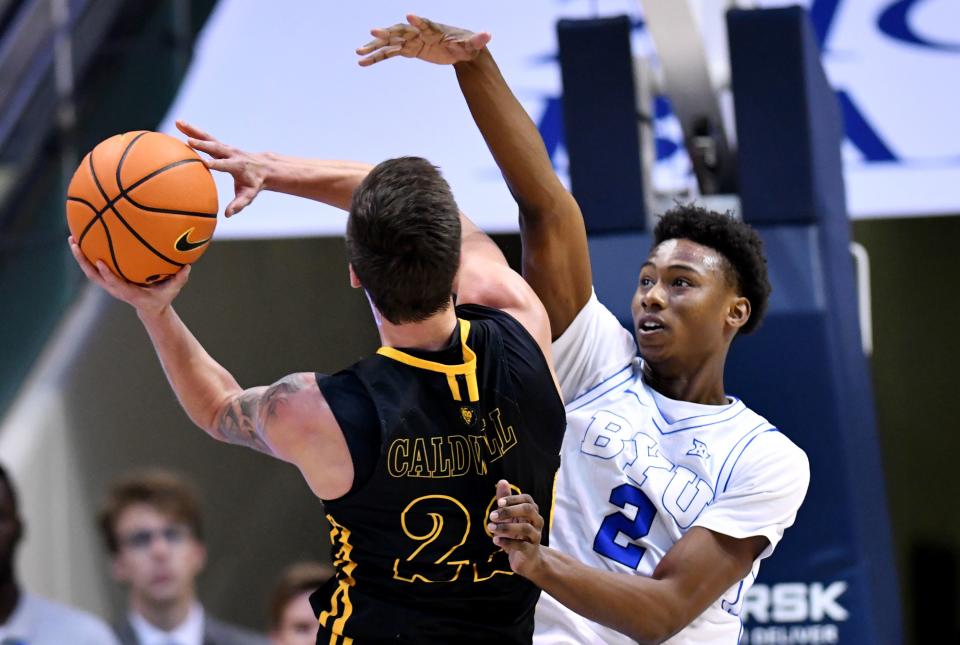 Brigham Young Cougars guard Jaxson Robinson (2) defends Southeastern Louisiana Lions guard Nick Caldwell (22) as BYU and SE Louisiana play at the Marriott Center in Provo on Wednesday, Nov. 15, 2023. BYU won 105-48. | Scott G Winterton, Deseret News
