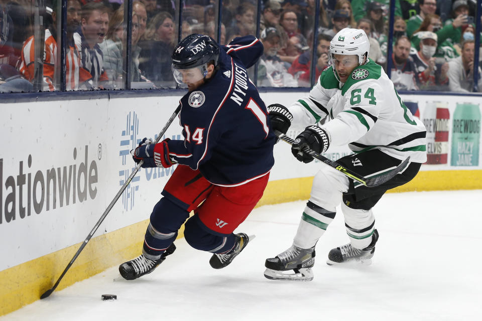 Dallas Stars' Tanner Kero, right, chases Columbus Blue Jackets' Gustav Nyquist behind the net during the second period of an NHL hockey game Monday, Oct. 25, 2021, in Columbus, Ohio. (AP Photo/Jay LaPrete)