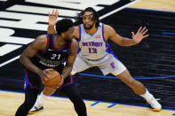 Philadelphia 76ers' Joel Embiid ,left, tries to get around Detroit Pistons' Jahlil Okafor during the first half of an NBA basketball game, Saturday, May 8, 2021, in Philadelphia. (AP Photo/Matt Slocum)