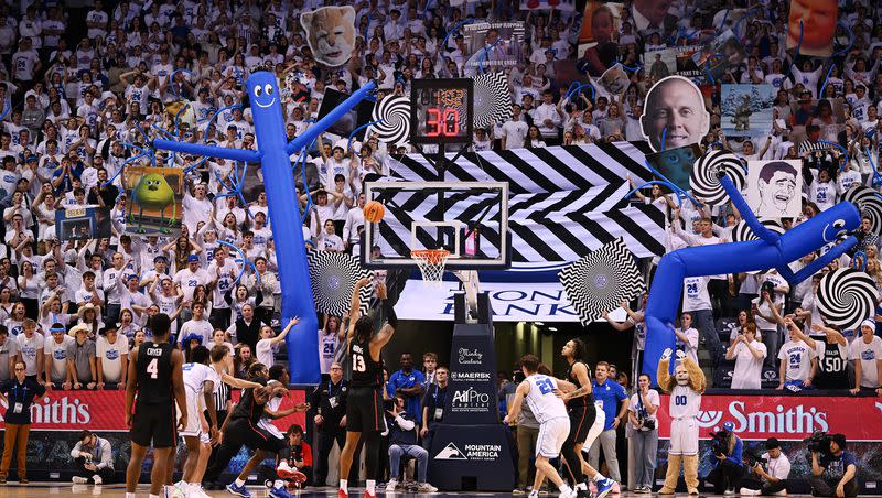 Brigham Young Cougars students try to disrupt Houston Cougars forward J’Wan Roberts (13) as he shoots a free throw as BYU and Houston play at the Marriott Center in Provo on Tuesday, Jan. 23, 2024. Houston won 75-68.