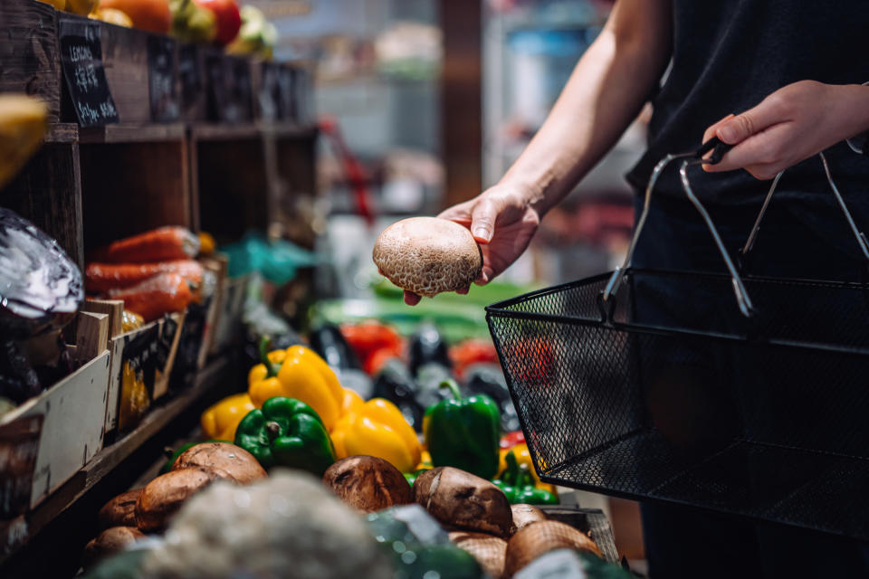 Woman carrying a shopping basket