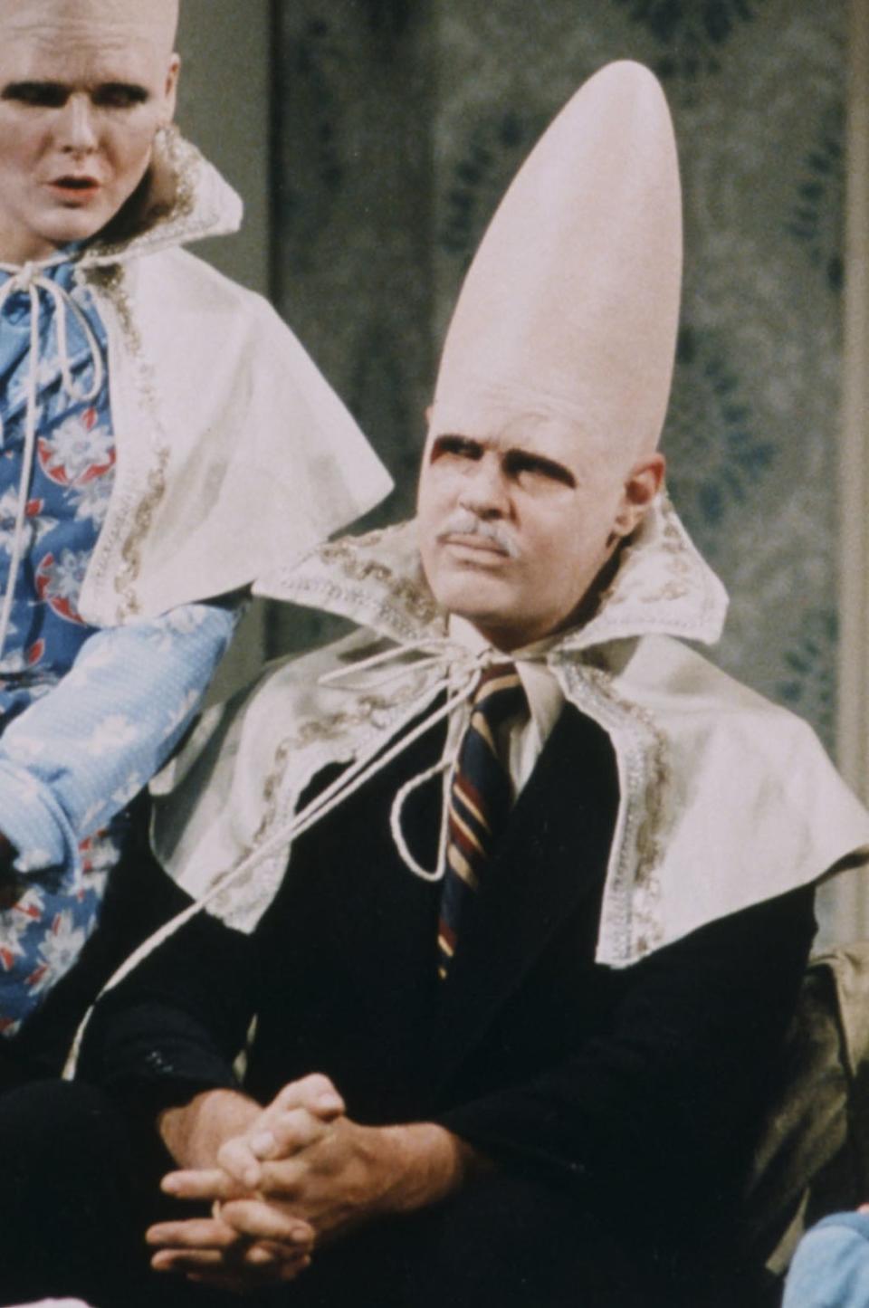 Jane Curtin as Prymaat Conehead, Dan Aykroyd as Beldar Conehead, Laraine Newman as Connie Conehead during the 'The Coneheads At Home' skit on January 15, 1977