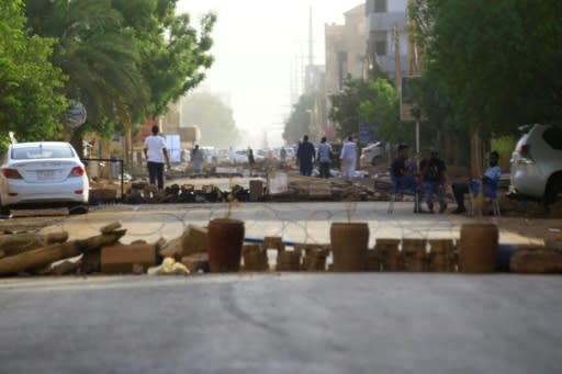 Protesters have blocked streets in Sudan's capital to to keep out military vehicles after a deadly crackdown by paramilitaries on a sit-in