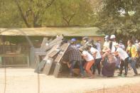 Protesters create a shield formation in Nyaung-U