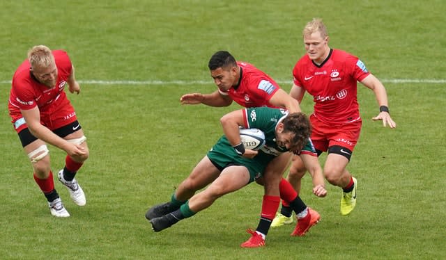 London Irish’s James Stokes is tackled down by Saracens fly-half Manu Vunipola