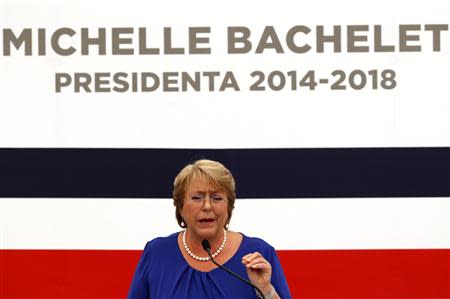 Chile's President-elect Michelle Bachelet answers a question during a news conference at her headquarters in Santiago, December 16, 2013. REUTERS/Ivan Alvarado