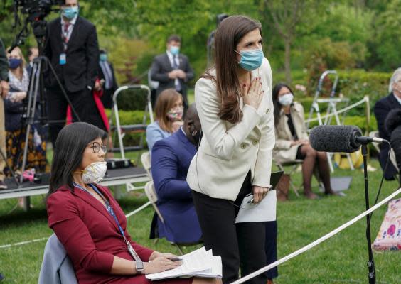 Weijia Jiang, left, of CBS and Kaitlan Collins of CNN ask questions of Donald Trump during a news conference in the Rose Garden of the White House. Following the exchange the president abruptly ended the briefing and walked away (REUTERS)