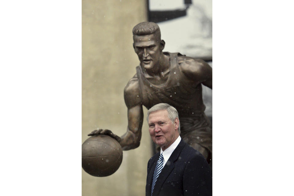 FILE - West Virginia Mountaineer basketball great Jerry West is shown with a bronze likeness of him that was unveiled Saturday, Feb. 17, 2007, in Morgantown, W.V. Jerry West, who was selected to the Basketball Hall of Fame three times in a storied career as a player and executive and whose silhouette is considered to be the basis of the NBA logo, died Wednesday morning, June 12, 2024, the Los Angeles Clippers announced. He was 86.(AP Photo/Micheal Switzer, File)