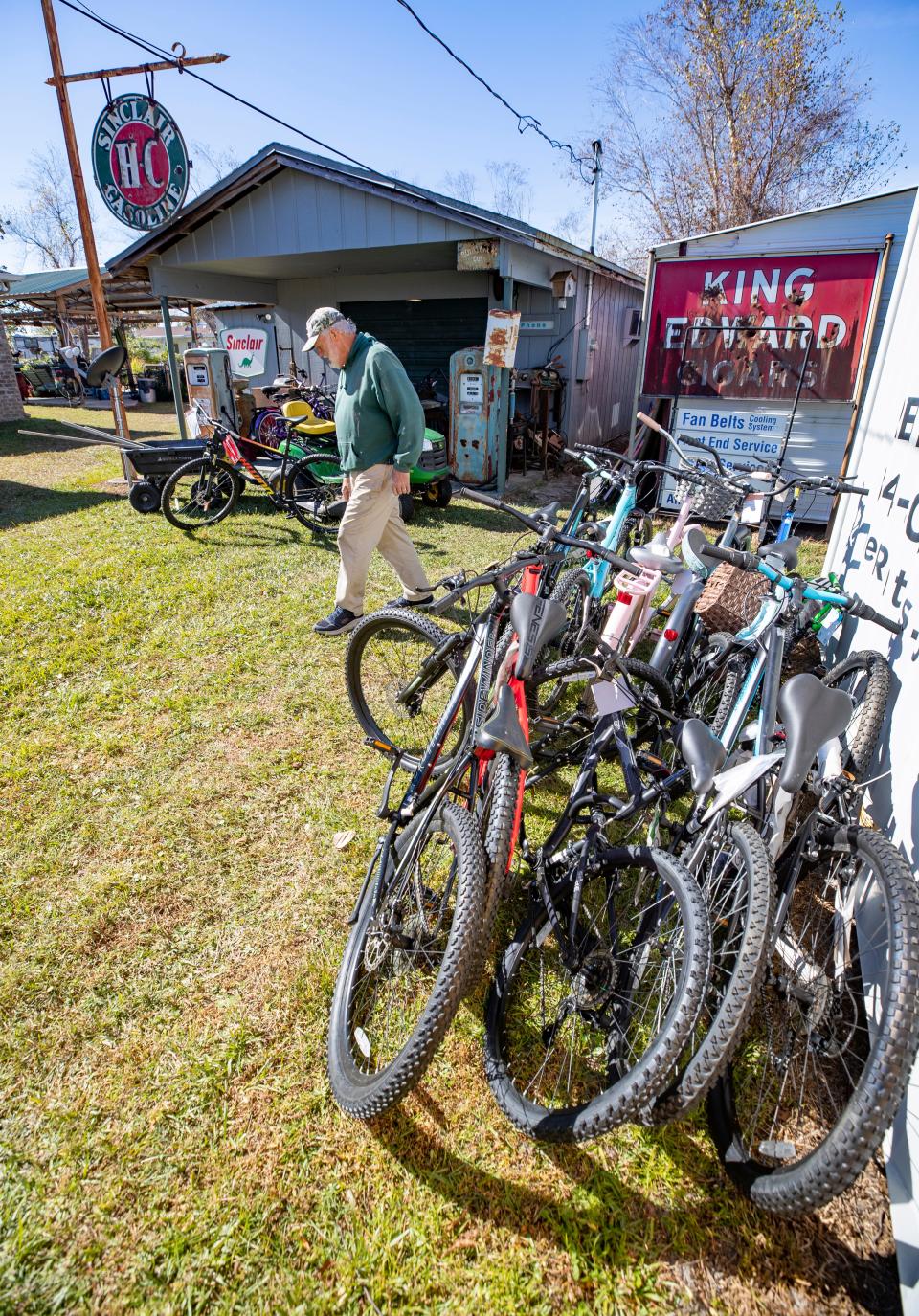 Mike Jones, aka Salvage Santa, takes old bicycles and makes them new again in his workshop on the northeast side of Panama City. Jones donates about 250 bicycles to area charities who distribute them to children for Christmas. Jones has bicycles all over his property, some in need of repair and some with repair completed. 