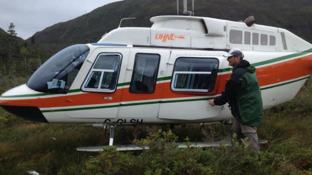 Stranded balloonist Jonathan Trappe boards a helicopter chartered by CBC after being stranded south of Lark Harbour on Thursday.