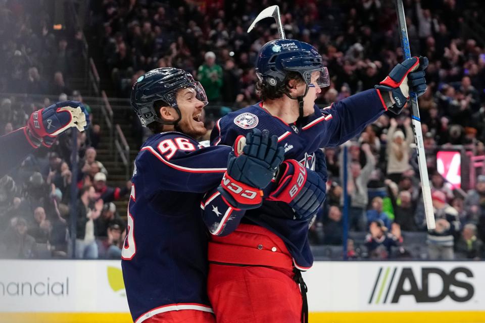 Jan 15, 2024; Columbus, Ohio, USA; Columbus Blue Jackets left wing Dmitri Voronkov (10) celebrates a goal with center Jack Roslovic (96) during the third period of the NHL hockey game against the Vancouver Canucks at Nationwide Arena. The Blue Jackets won 4-3 in a shootout.