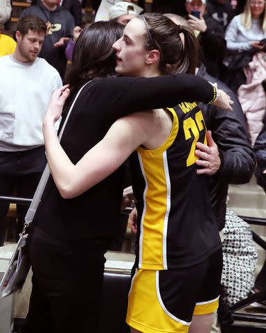 <p>Brian Spurlock/Icon Sportswire via Getty</p> Iowa Hawkeyes guard Caitlin Clark hugs her Mom after the game against the Purdue Boilermakers on January 10, 2024.