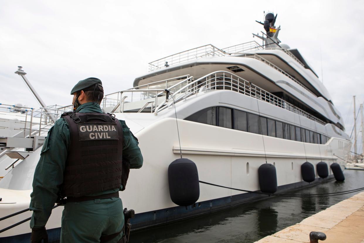 A Civil Guard stands by the yacht called Tango in Palma de Mallorca, Spain, Monday April 4, 2022