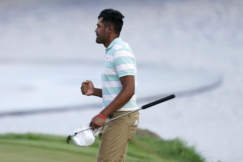 Tony Finau celebrates his win in the 3M Open golf tournament at the Tournament Players Club in Blaine, Minn., Sunday, July 24, 2022. (AP Photo/Abbie Parr)