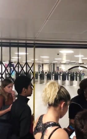 Passengers are seen inside a Vauxhall Underground Station during the power cut in central London