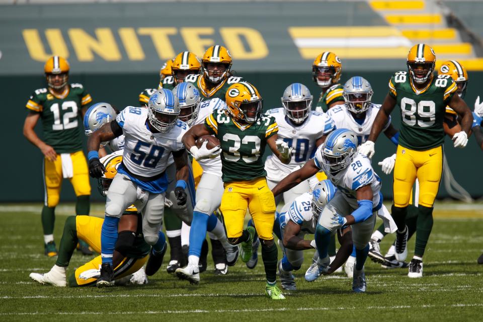 Green Bay Packers' Aaron Jones runs for a touchdown during the second half of an NFL football game against the Detroit Lions Sunday, Sept. 20, 2020, in Green Bay, Wis. (AP Photo/Matt Ludtke)