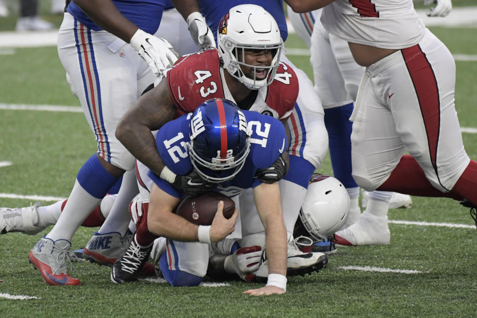 Arizona Cardinals' Haason Reddick, top, reacts as he sacks New York Giants quarterback Colt McCoy during the second half of an NFL football game, Sunday, Dec. 13, 2020, in East Rutherford, N.J. (AP Photo/Bill Kostroun)