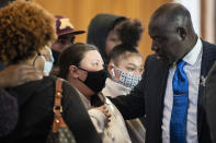 Katie Wright, mother of Duante Wright, speaks with attorney Ben Crump, right, during a news conference at New Salem Missionary Baptist Church, Thursday, April 15, 2021, in Minneapolis. (AP Photo/John Minchillo)