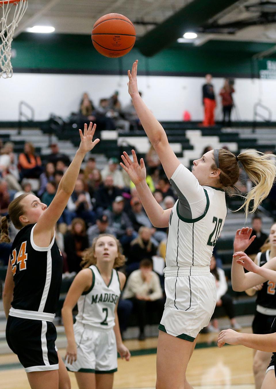 Madison High School's Chloe Ebeling (20) puts up a shot over Ashland High School's Audra McBride (24) during high school girls basketball at Madison on Thursday, Jan. 12, 2023. TOM E. PUSKAR/ASHLAND TIMES-GAZETTE