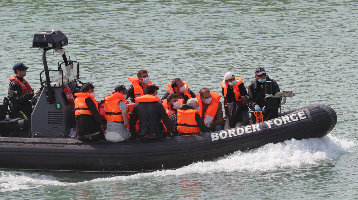 A group of people thought to be migrants are brought into Dover, Kent, by Border Force officers following a number of small boat incidents in the Channel earlier today.