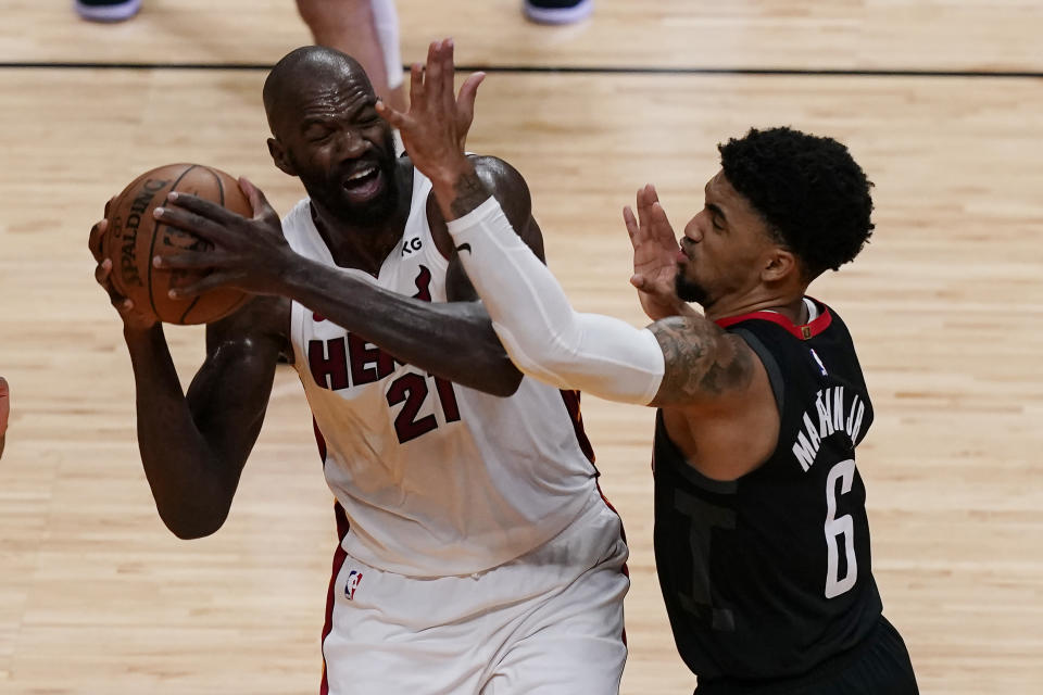 Houston Rockets forward Kenyon Martin Jr. (6) defends Miami Heat center Dewayne Dedmon (21), during the second half of an NBA basketball game, Monday, April 19, 2021, in Miami. (AP Photo/Marta Lavandier)