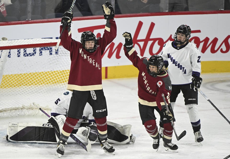 Montreal's Claire Dalton (42) reacts after scoring against Minnesota goaltender Maddie Rooney as Montreal's Ann-Sophie Bettez (24) and Minnesota's Natalie Buchbinder (22) look on during the first period of a PWHL hockey game in Laval, Quebec, Sunday, Feb. 18, 2024. (Graham Hughes/The Canadian Press via AP)