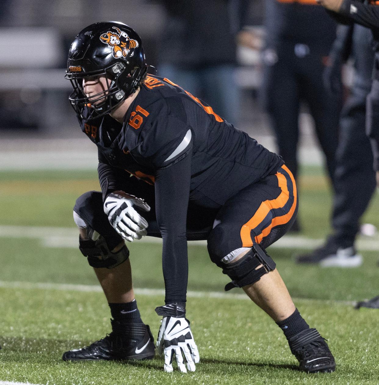 Massillon offensive tackle Nolan Davenport warms up before a playoff game against Lake, Friday, Nov. 10, 2023.