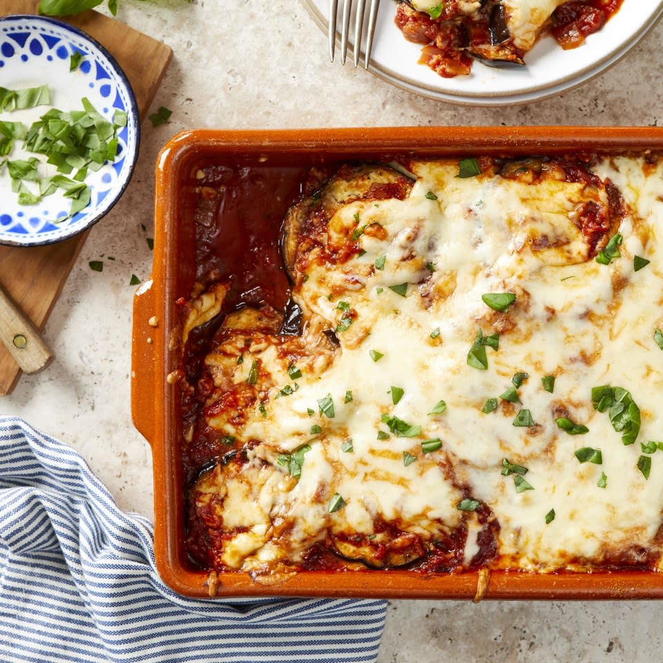 <p>This cheesy baked eggplant Parmesan has no breading, which means it's easier to make than the traditional version. There's no dredging or frying--instead, the eggplant is roasted until tender before being layered in the casserole dish with a tangy homemade tomato sauce, mozzarella and Parmesan cheese. And without breading, this satisfying eggplant Parmesan is also gluten-free! <a href="https://www.eatingwell.com/recipe/272928/gluten-free-eggplant-parmesan/" rel="nofollow noopener" target="_blank" data-ylk="slk:View Recipe" class="link ">View Recipe</a></p>