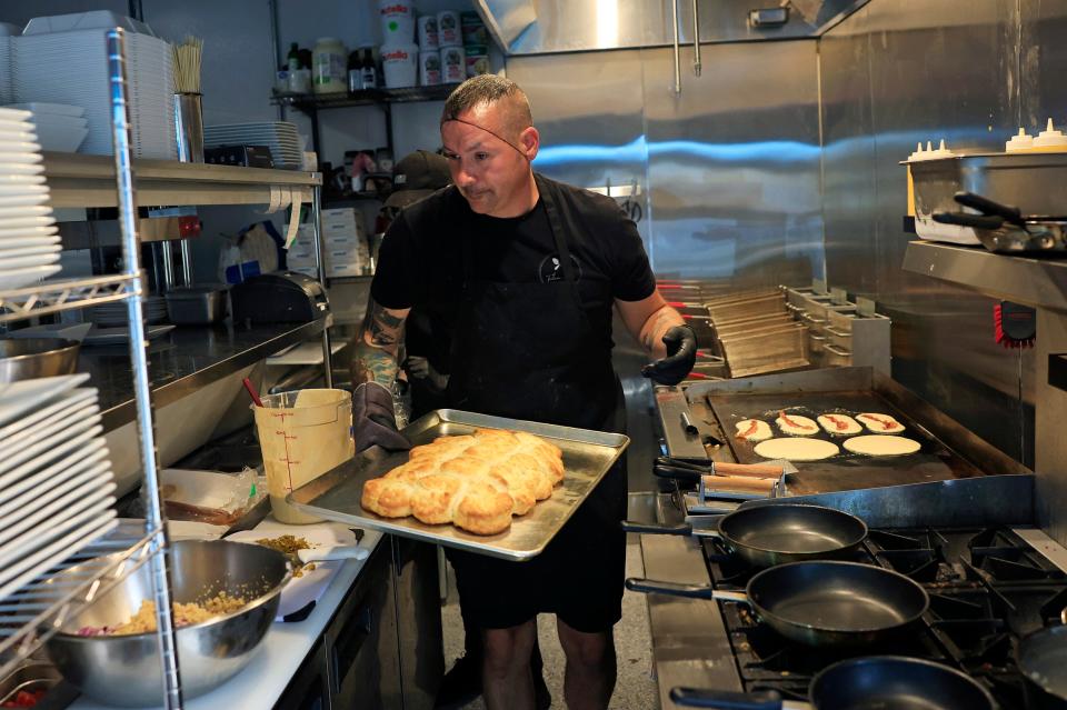 Joey Brown, founder, owner and head chef, cooks breakfast at newly opened Tulua Bistro, at 1703 N. Main St. in historic Springfield.