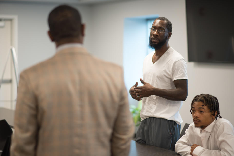 A participant speaks during a 'Save Our Sons' course.