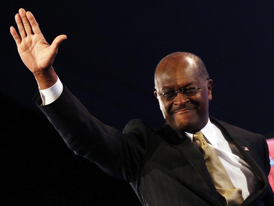 Herman Cain is introduced prior to a debate