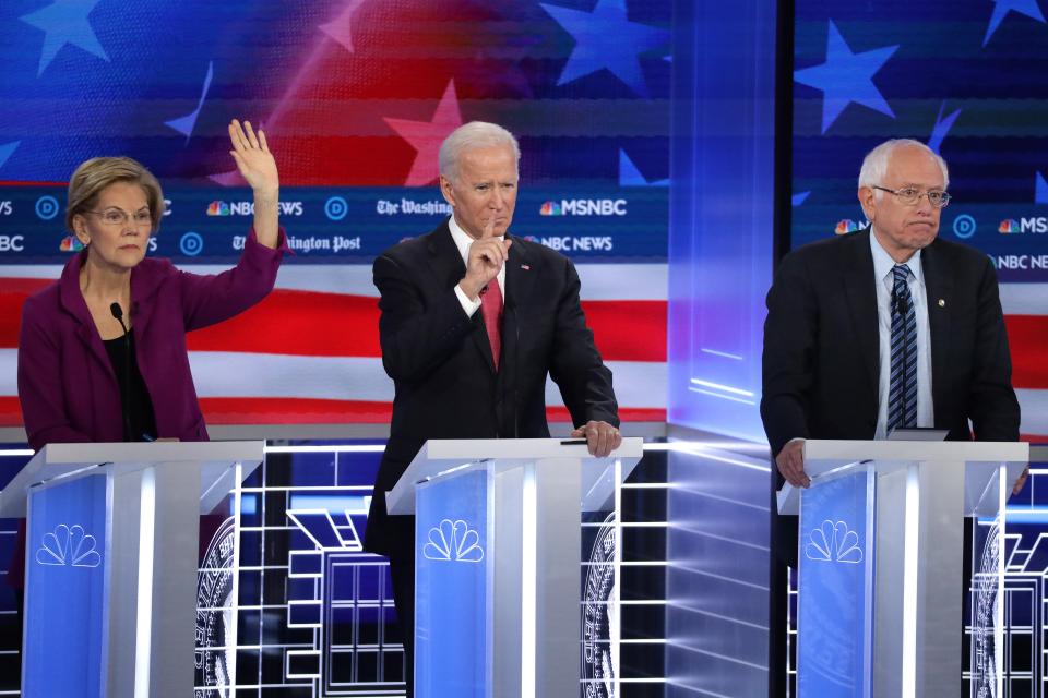 Sen. Elizabeth Warren, former Vice President Joe Biden and Sen. Bernie Sanders at the Democratic presidential debate in Atlanta on Nov. 20, 2019.