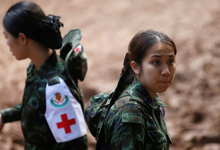 Personnel work near Tham Luang cave complex during a search for members of an under-16 soccer team and their coach, in the northern province of Chiang Rai, Thailand, June 28, 2018. REUTERS/Soe Zeya Tun