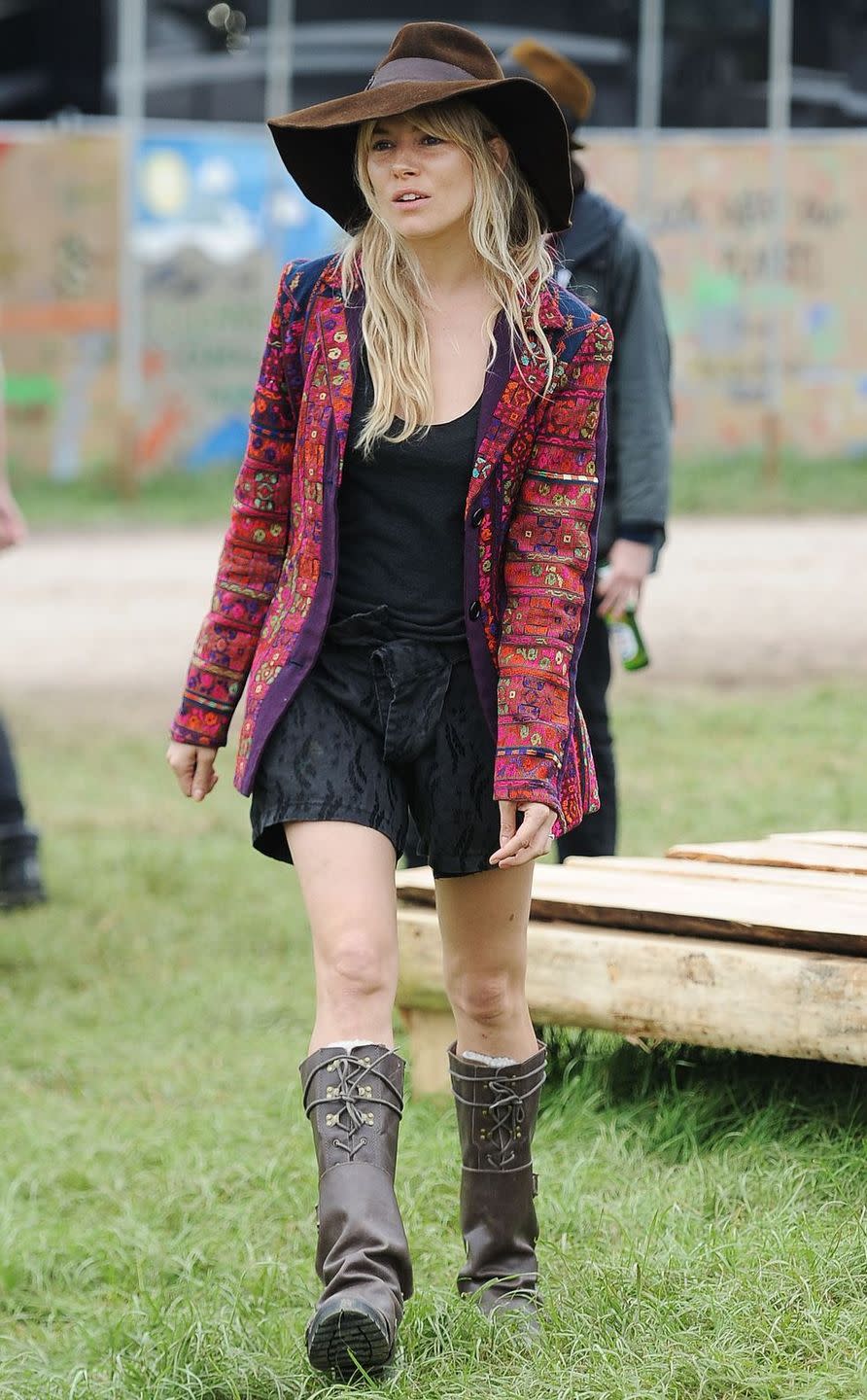 <p>A seasoned Glastonbury-goer, Sienna Miller is know almost as much for her festival appearances as she is her film roles. Her vintage jacket and fedora combo soon became a festival staple.</p>