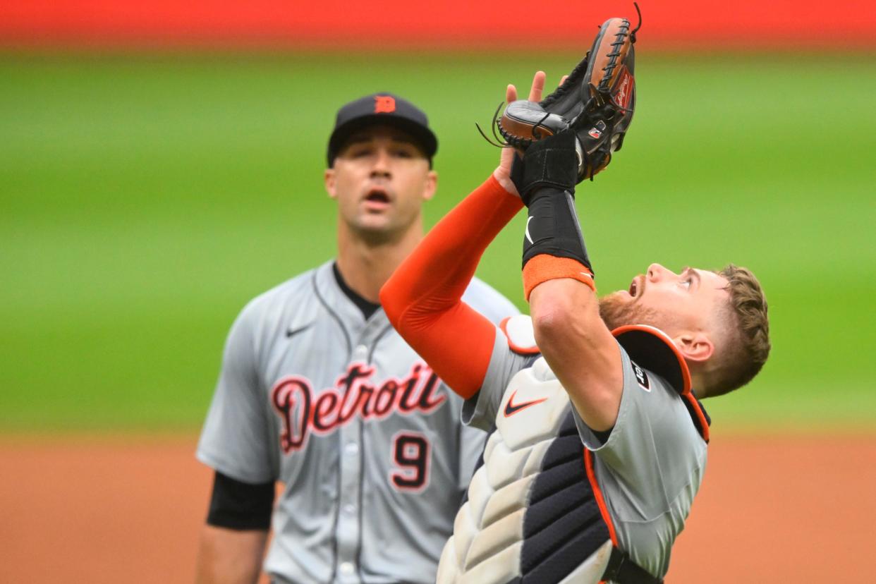 Detroit Tigers catcher Carson Kelly (15) looks for a foul ball beside starting pitcher Jack Flaherty (9) in the first inning against the Cleveland Guardians at Progressive Field in Cleveland on Wednesday, July 24, 2024.