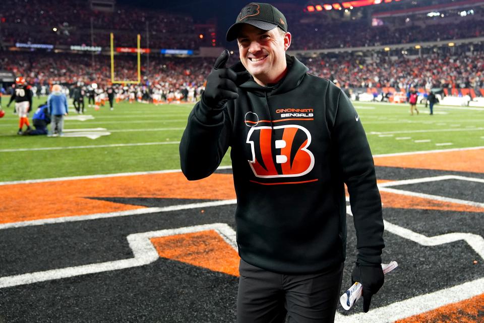 Cincinnati Bengals head coach Zac Taylor gestures toward the fans coming off the field at the conclusion of the fourth quarter during an NFL AFC wild-card playoff game, Saturday, Jan. 15, 2022, at Paul Brown Stadium in Cincinnati.  The Cincinnati Bengals defeated the Las Vegas Raiders, 26-19 to win the franchise's first playoff game in 30 years.