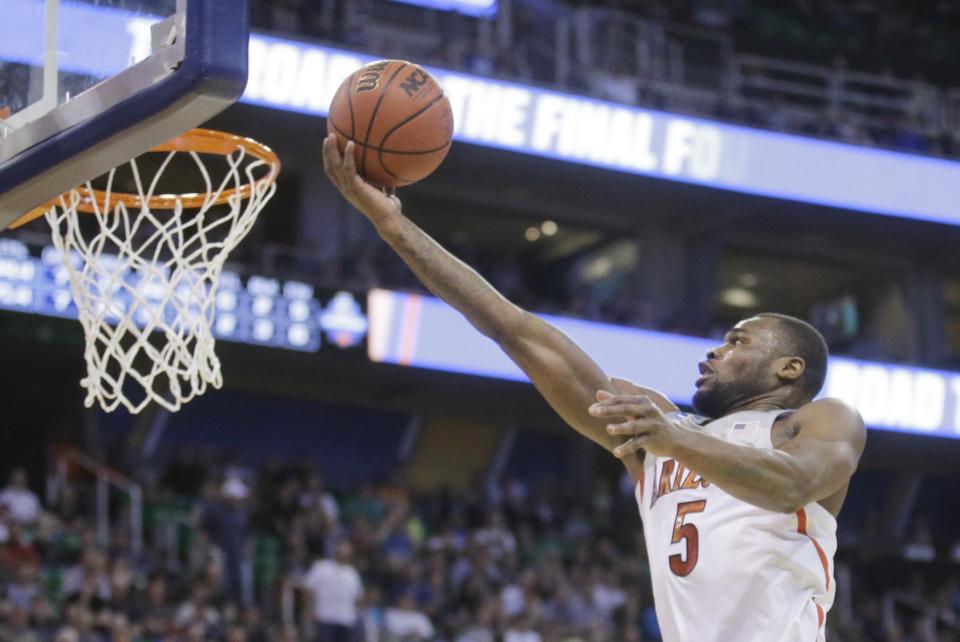 Arizona guard Kadeem Allen lays the ball up during the second half against North Dakota in a first-round game in the NCAA men's college basketball tournament Thursday, March 16, 2017, in Salt Lake City. Arizona won 100-82. (AP Photo/Rick Bowmer)