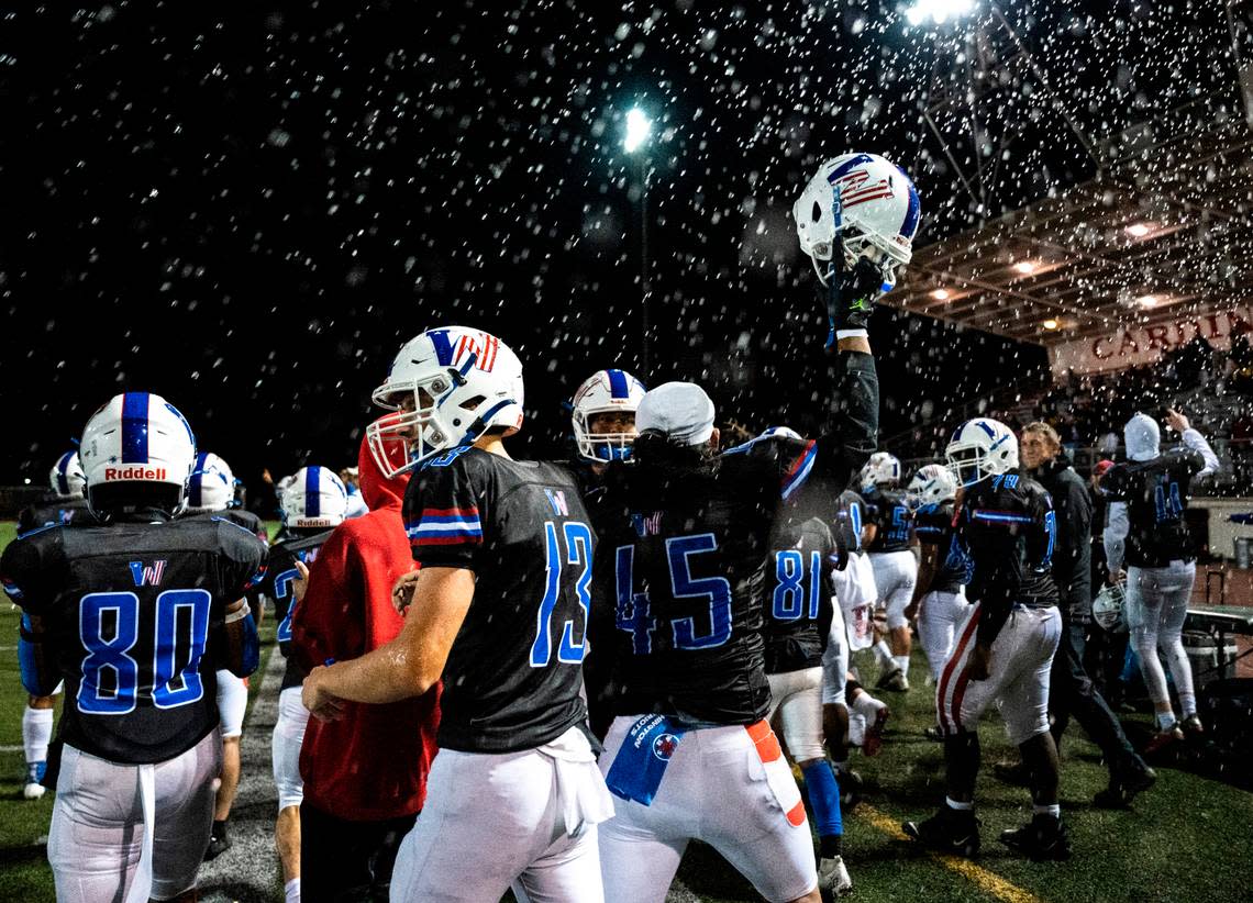 Washington players celebrate on the sidelines after winning a 2A first round district playoff game against Steilacoom at Franklin Pierce Stadium in Tacoma, Wash. on Nov. 4, 2022. Washington defeated Steailacoom 36-8.