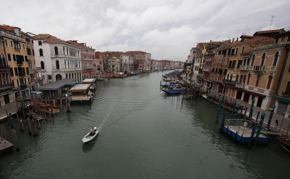 In this picture taken on Wednesday, May 13, 2020, a view of the Canal Grande (Grand Canal) in Venice, Italy. Venetians are rethinking their city in the quiet brought by the coronavirus pandemic. For years, the unbridled success of Venice's tourism industry threatened to ruin the things that made it an attractive destination to begin with. Now the pandemic has ground to a halt Italy’s most-visited city, stopped the flow of 3 billion euros in annual tourism-related revenue and devastated the city's economy. (AP Photo/Antonio Calanni)