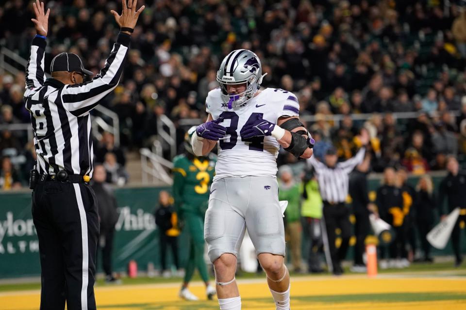 Kansas State tight end Ben Sinnott (34) celebrates after catching a touchdown pass against Baylor last Nov. 12 at McLane Stadium in Waco, Texas.