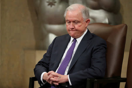 FILE PHOTO: U.S. Attorney General Jeff Sessions waits to speak at a National Opioid Summit at the Justice Department in Washington,. October 25, 2018. REUTERS/Jonathan Ernst/File Photo