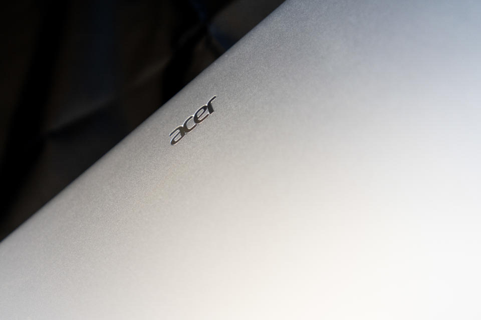 An Acer Swift Go 14 OLED laptop on a black background