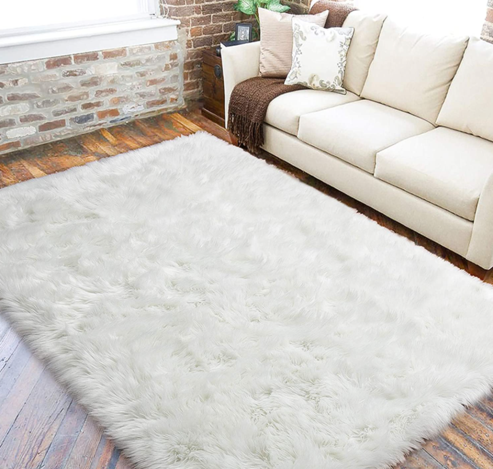 LOCHAS White Faux Fur Sheepskin Area Rug in White (Photo via Amazon)