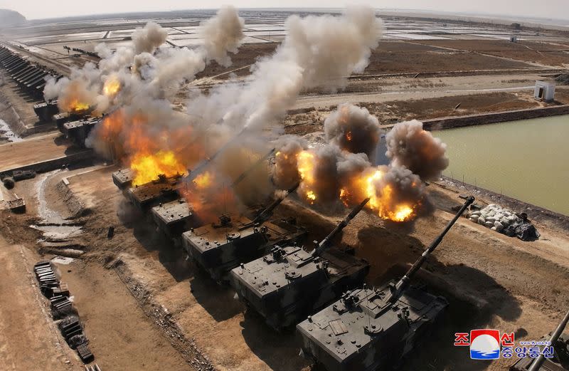 North Korean leader Kim Jong Un guides an artillery firing drill by the Korean People's Army