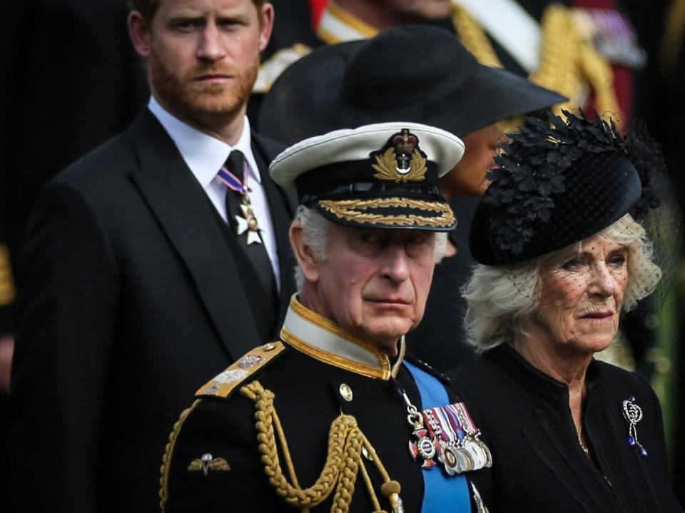 Britain's King Charles III (L), Britain's Camilla, Queen Consort and Britain's Prince Harry, Duke of Sussex