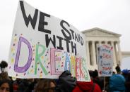 FILE PHOTO: Demonstrators rally outside the U.S. Supreme Court during oral arguments in cases regarding the Trump administration’s bid to end the DACA program in Washington