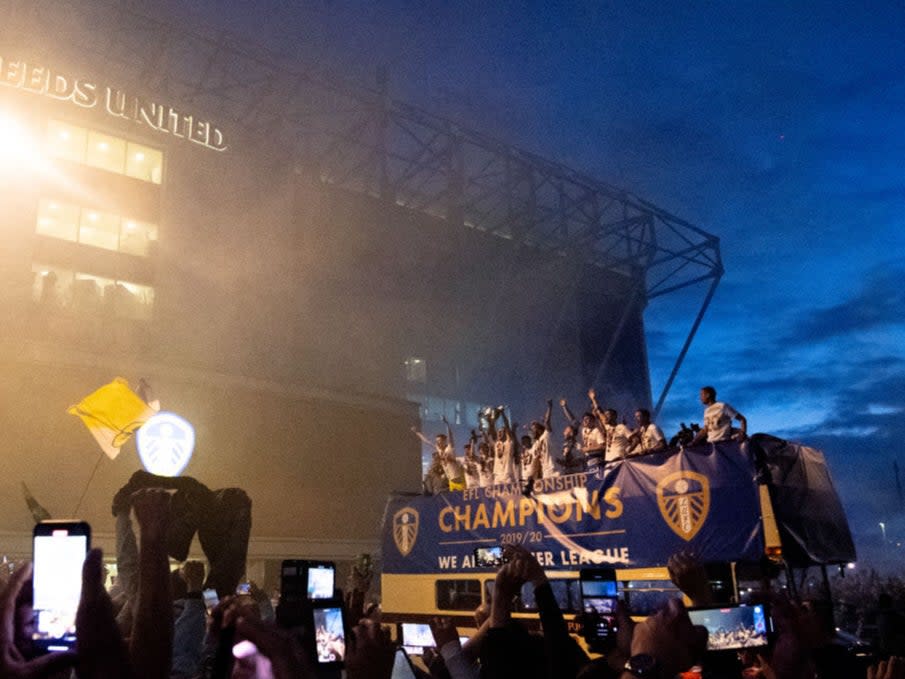 Leeds lift the trophy outside Elland Road (Getty)