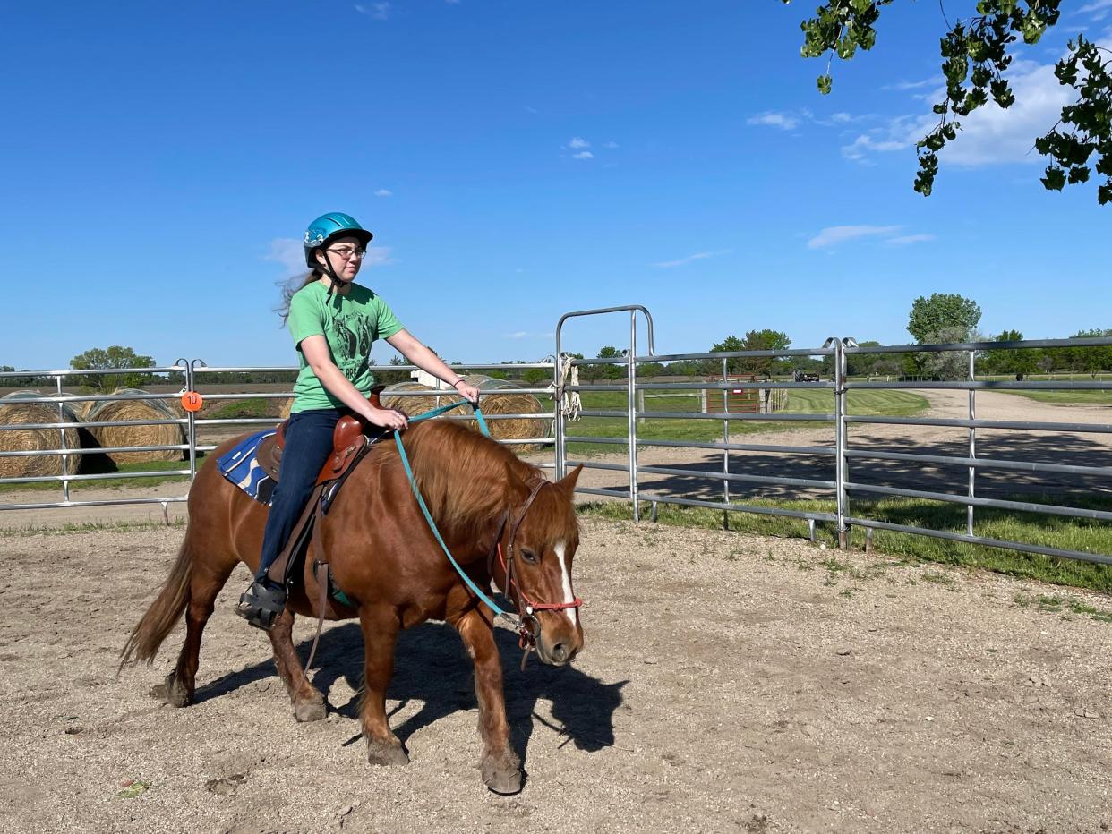 Eschenbaum rides her horse during a training session at SPURS Therapeutic Riding Center.